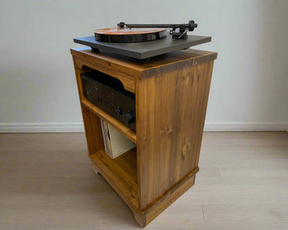 Wooden record player cabinet with turntable on a plain background