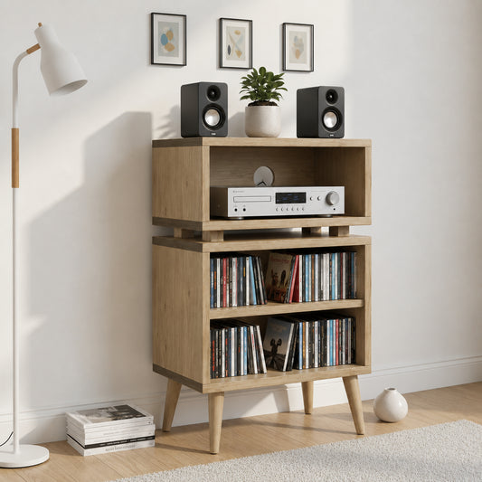 A mid-century modern wooden media console shelf with tapered legs, styled in a living room setting with speakers, a CD player, books, a floor lamp, and framed wall art.